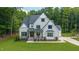 Beautiful two-story home featuring a manicured lawn, neutral color palette, and a welcoming front porch at 91 Ivy Ridge Rd, Chapel Hill, NC 27516