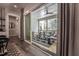 Hallway view showcasing sliding glass doors to the screened porch with modern furniture at 91 Ivy Ridge Rd, Chapel Hill, NC 27516