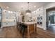 Spacious kitchen featuring a large island, pendant lighting, and modern appliances at 91 Ivy Ridge Rd, Chapel Hill, NC 27516