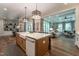 Bright and airy kitchen open to the living area with hardwood floors at 91 Ivy Ridge Rd, Chapel Hill, NC 27516