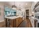 Gourmet kitchen featuring an island, stainless steel appliances, and hardwood floors at 91 Ivy Ridge Rd, Chapel Hill, NC 27516