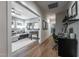 Open-concept living space with hardwood floors, foosball table, and comfortable seating area at 91 Ivy Ridge Rd, Chapel Hill, NC 27516