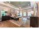 Tranquil primary bedroom with tray ceiling, ample natural light, and sophisticated furnishings at 91 Ivy Ridge Rd, Chapel Hill, NC 27516