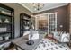 Home office showcasing a modern desk, comfortable seating, and elegant French doors at 91 Ivy Ridge Rd, Chapel Hill, NC 27516