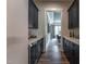 Walk-through pantry with modern white subway tile and lots of storage at 91 Ivy Ridge Rd, Chapel Hill, NC 27516