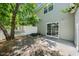 View of the backyard brick patio with privacy fence and sliding glass doors to the house at 1003 Crimson Dr, Durham, NC 27713