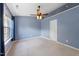 Inviting bedroom with ceiling fan, natural light, and plush carpeting at 1003 Crimson Dr, Durham, NC 27713