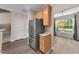 Kitchen featuring stainless steel refrigerator with access to additional rooms at 1003 Crimson Dr, Durham, NC 27713