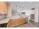 Kitchen featuring stainless steel dishwasher and sink with views into the living area at 1003 Crimson Dr, Durham, NC 27713