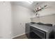 Laundry room with shelving and new washer and dryer at 1003 Crimson Dr, Durham, NC 27713