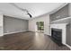 Cozy living room features a fireplace and sliding glass doors to the backyard at 1003 Crimson Dr, Durham, NC 27713