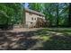 The house boasts a spacious backyard with a wooden deck and stairs at 1005 Temple St, Raleigh, NC 27609