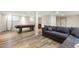 Finished basement area with a pool table, rustic bar, and comfortable seating at 1005 Temple St, Raleigh, NC 27609