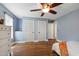 Bedroom with hardwood floors, two closets, and neutral paint at 1005 Temple St, Raleigh, NC 27609