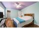 Bedroom with wood floors and ensuite bathroom at 1005 Temple St, Raleigh, NC 27609