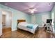 Bedroom with wood floors, desk, and access to other areas at 1005 Temple St, Raleigh, NC 27609