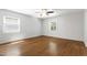 Bedroom featuring hardwood floors, neutral walls, and bright windows at 1005 Temple St, Raleigh, NC 27609