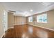 Spacious bonus room featuring wood flooring, two windows, and natural light at 1005 Temple St, Raleigh, NC 27609