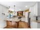 Well-equipped kitchen with an island, granite countertops, and modern lighting fixtures at 1005 Temple St, Raleigh, NC 27609