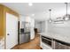 Kitchen and island featuring granite countertops and stainless steel appliances at 1005 Temple St, Raleigh, NC 27609