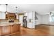 Modern kitchen featuring an island, stainless steel appliances, and ample cabinet space at 1005 Temple St, Raleigh, NC 27609