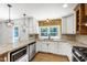 Bright and functional kitchen with stainless steel appliances, and granite countertops at 1005 Temple St, Raleigh, NC 27609