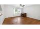 Bright living room with hardwood floors, and a decorative piano at 1005 Temple St, Raleigh, NC 27609