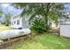 Large backyard featuring a storage shed and ample space for outdoor activities at 102 S College Ave, Kenly, NC 27542