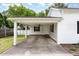 Attached carport featuring a ceiling fan and convenient access to the home at 102 S College Ave, Kenly, NC 27542