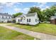 Quaint one-story home with a covered carport and a well-maintained lawn at 102 S College Ave, Kenly, NC 27542