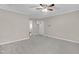 Spacious living room with neutral carpet and natural light coming through the front door at 102 S College Ave, Kenly, NC 27542