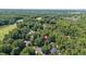 Overhead view of home near a golf course and lush trees at 102 Winged Foot Ct, Mebane, NC 27302