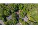An aerial view of the home featuring a densely wooded lot at 102 Winged Foot Ct, Mebane, NC 27302