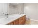 Bright bathroom featuring a double sink vanity with framed mirror at 102 Winged Foot Ct, Mebane, NC 27302