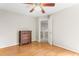 Hardwood floor bedroom featuring a ceiling fan and wooden dresser at 102 Winged Foot Ct, Mebane, NC 27302