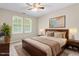 Comfortable bedroom with large windows and natural light at 102 Winged Foot Ct, Mebane, NC 27302