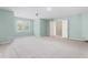 A bonus room with carpet, two windows, and open door at 102 Winged Foot Ct, Mebane, NC 27302