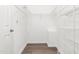 Walk-in closet featuring wire shelving, base molding, and dark wood floors at 102 Winged Foot Ct, Mebane, NC 27302