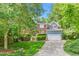 Charming two-story home with brick and siding, red shutters, and a well-maintained lawn at 102 Winged Foot Ct, Mebane, NC 27302