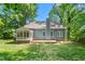 Rear exterior of the house with large yard at 102 Winged Foot Ct, Mebane, NC 27302