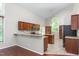 Bright kitchen features granite countertops, stainless appliances and an island at 102 Winged Foot Ct, Mebane, NC 27302