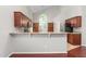 Open kitchen with granite countertops and stainless steel appliances at 102 Winged Foot Ct, Mebane, NC 27302