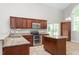 Kitchen with island, stainless steel appliances and granite countertops at 102 Winged Foot Ct, Mebane, NC 27302