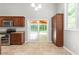 Eat in kitchen features stainless appliances, granite tops, and sliding doors to outside at 102 Winged Foot Ct, Mebane, NC 27302