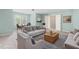 Cozy living room with plush seating and ample natural light at 102 Winged Foot Ct, Mebane, NC 27302