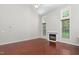 Spacious living room with hardwood floors and a cozy fireplace at 102 Winged Foot Ct, Mebane, NC 27302