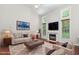 Cozy living room with a vaulted ceiling, plush seating, and a marble fireplace at 102 Winged Foot Ct, Mebane, NC 27302