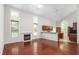 Open concept living room featuring hardwood floors, fireplace and natural light at 102 Winged Foot Ct, Mebane, NC 27302