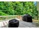 Inviting back deck featuring wooded views and a grill at 10304 Stallion Way, Bahama, NC 27503