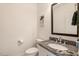 Elegant bathroom features a granite countertop, white vanity, and a modern mirror at 10304 Stallion Way, Bahama, NC 27503